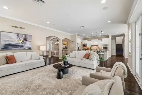a kitchen with refrigerator cabinets and wooden floor