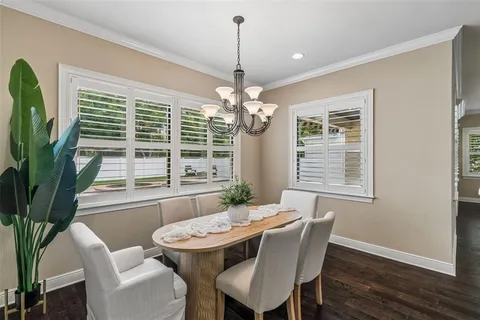 a kitchen with stainless steel appliances granite countertop a sink a stove and cabinets