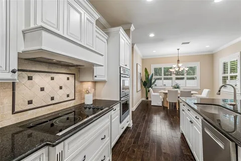 an empty room with ceiling fan and window