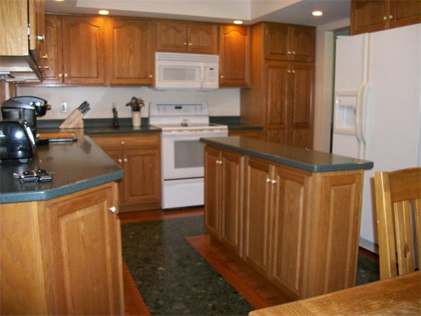 33 Allen Road Billerica, MA 01821 - Photo 6 of 18 a kitchen with stainless steel appliances a sink stove and refrigerator