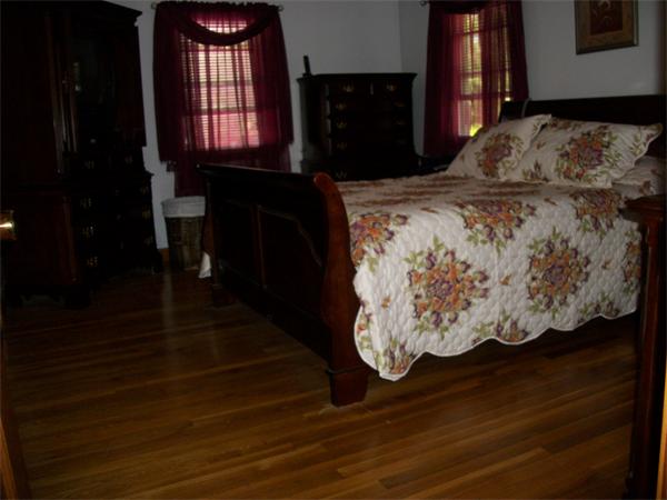 33 Allen Road Billerica, MA 01821 - Photo 9 of 18 a bed sitting in a bedroom next to a window