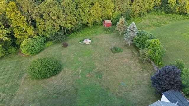 a kitchen with sink cabinets and wooden floor