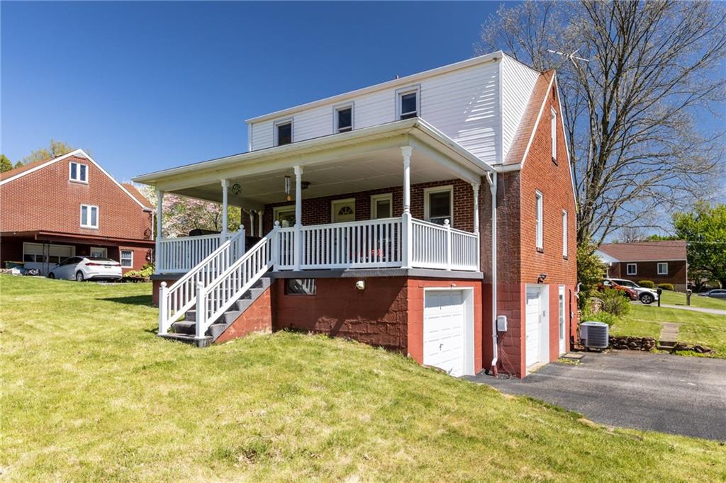 16 Ellen Drive McKees Rocks, PA 15136 - Photo 14 of 14 a front view of a house with a yard