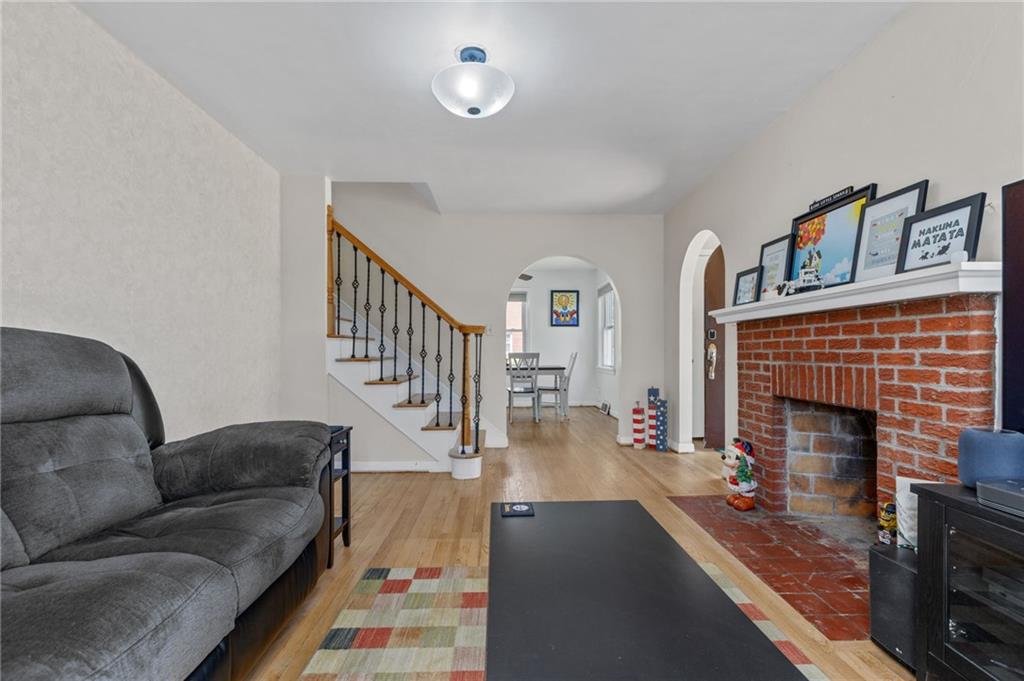 16 Ellen Drive McKees Rocks, PA 15136 - Photo 4 of 14 a living room with furniture and a fireplace