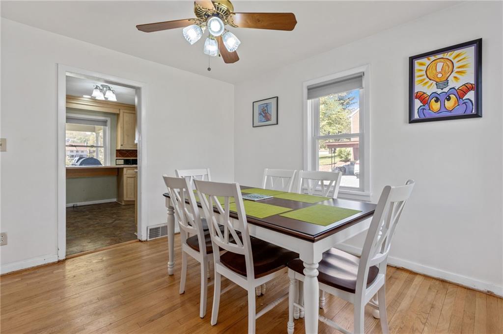 16 Ellen Drive McKees Rocks, PA 15136 - Photo 5 of 14 a view of a dining room with furniture and wooden floor