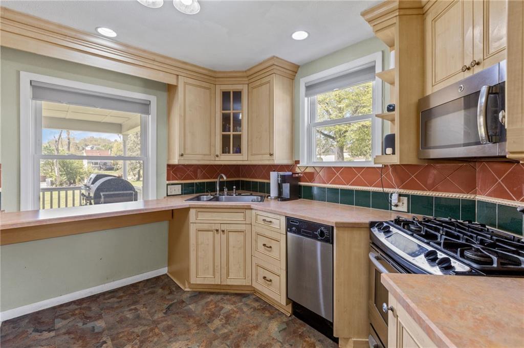 16 Ellen Drive McKees Rocks, PA 15136 - Photo 6 of 14 a kitchen with a stove and a sink