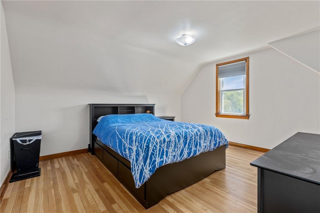 16 Ellen Drive McKees Rocks, PA 15136 - Photo 10 of 14 a bedroom with a bed and wooden floor