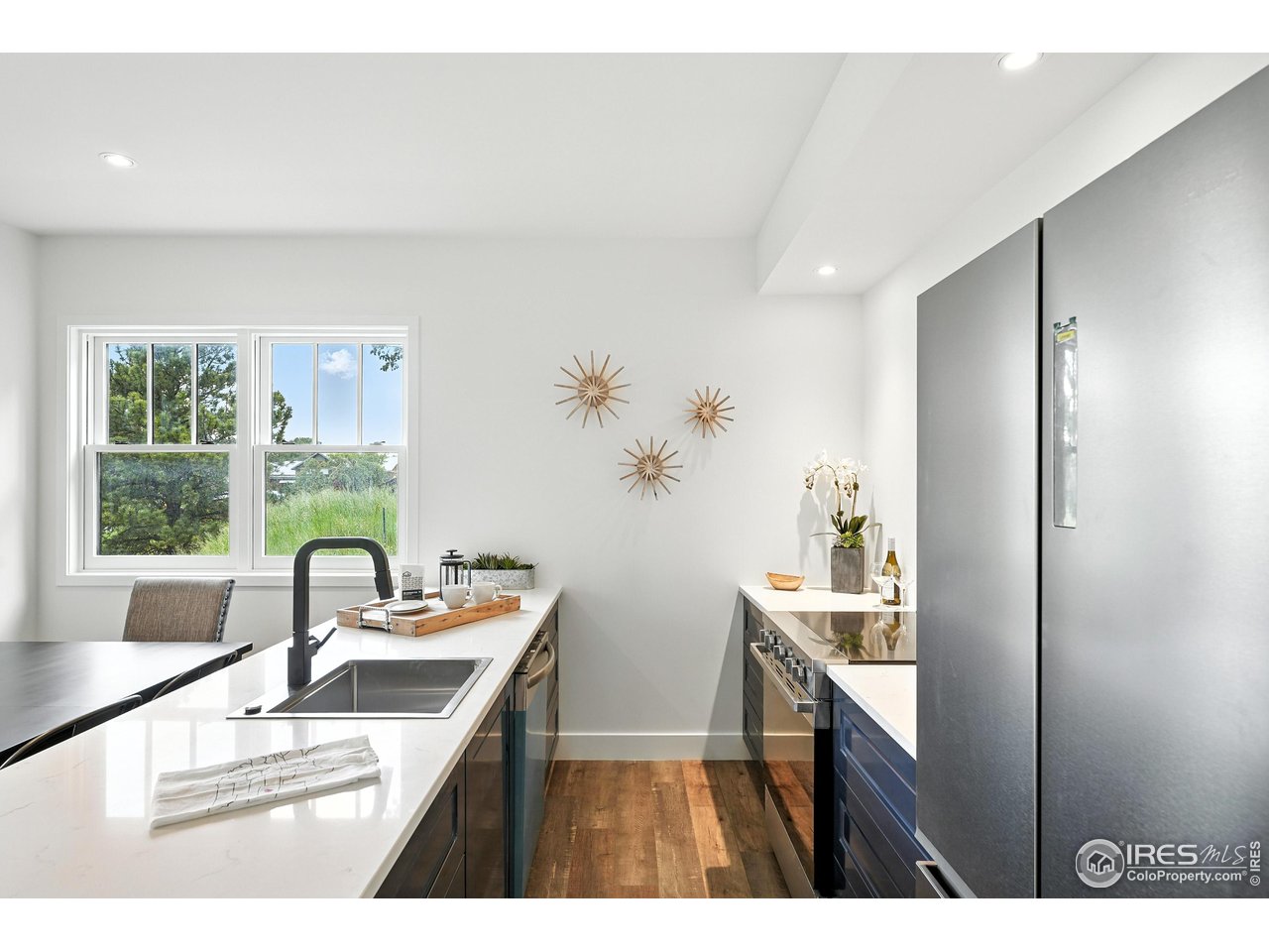 360 Boulder Street Boulder, CO 80302 - Photo 13 of 37 a kitchen with sink refrigerator and window