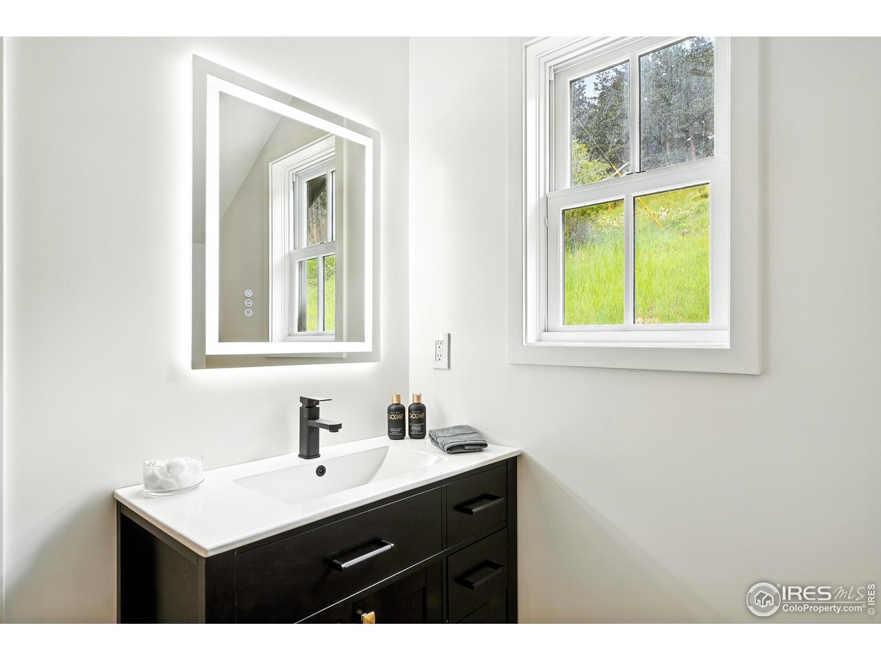 360 Boulder Street Boulder, CO 80302 - Photo 30 of 37 a bathroom with a sink vanity and a mirror