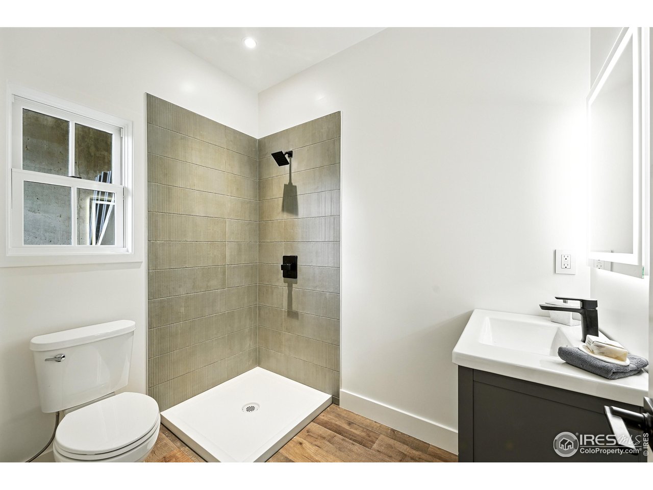 360 Boulder Street Boulder, CO 80302 - Photo 7 of 37 a bathroom with a toilet a sink and shower