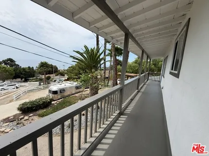 a view of balcony and car