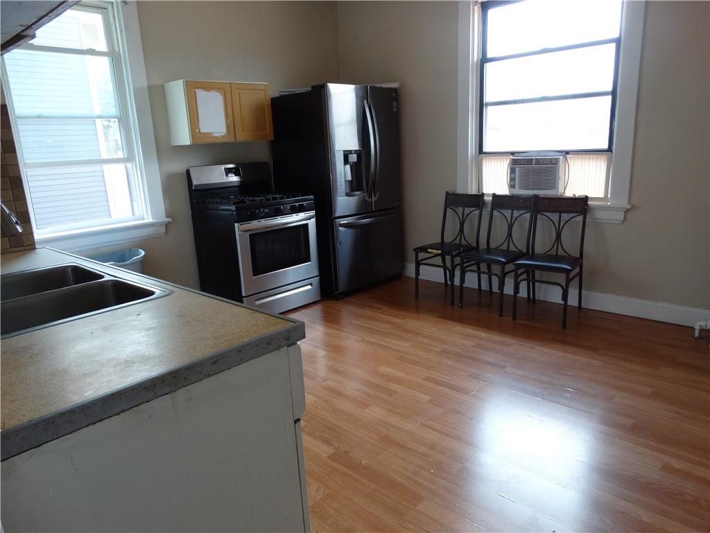 511 Chestnut Street Carnegie, PA 15106 - Photo 12 of 24 a kitchen with granite countertop a refrigerator stove and sink