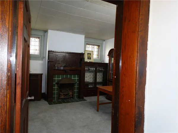 a room with fireplace and a flat screen tv