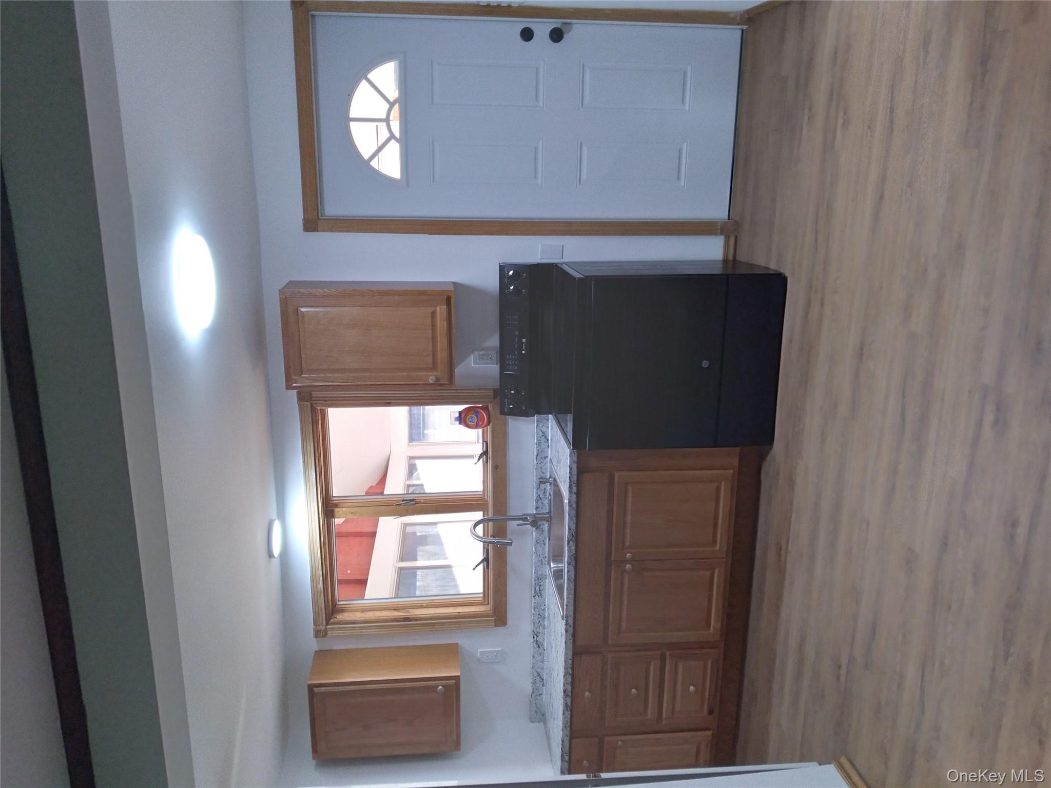 31 Willowemoc Road Livingston Manor, NY 12758 - Photo 13 of 23 a kitchen with granite countertop a refrigerator and cabinets