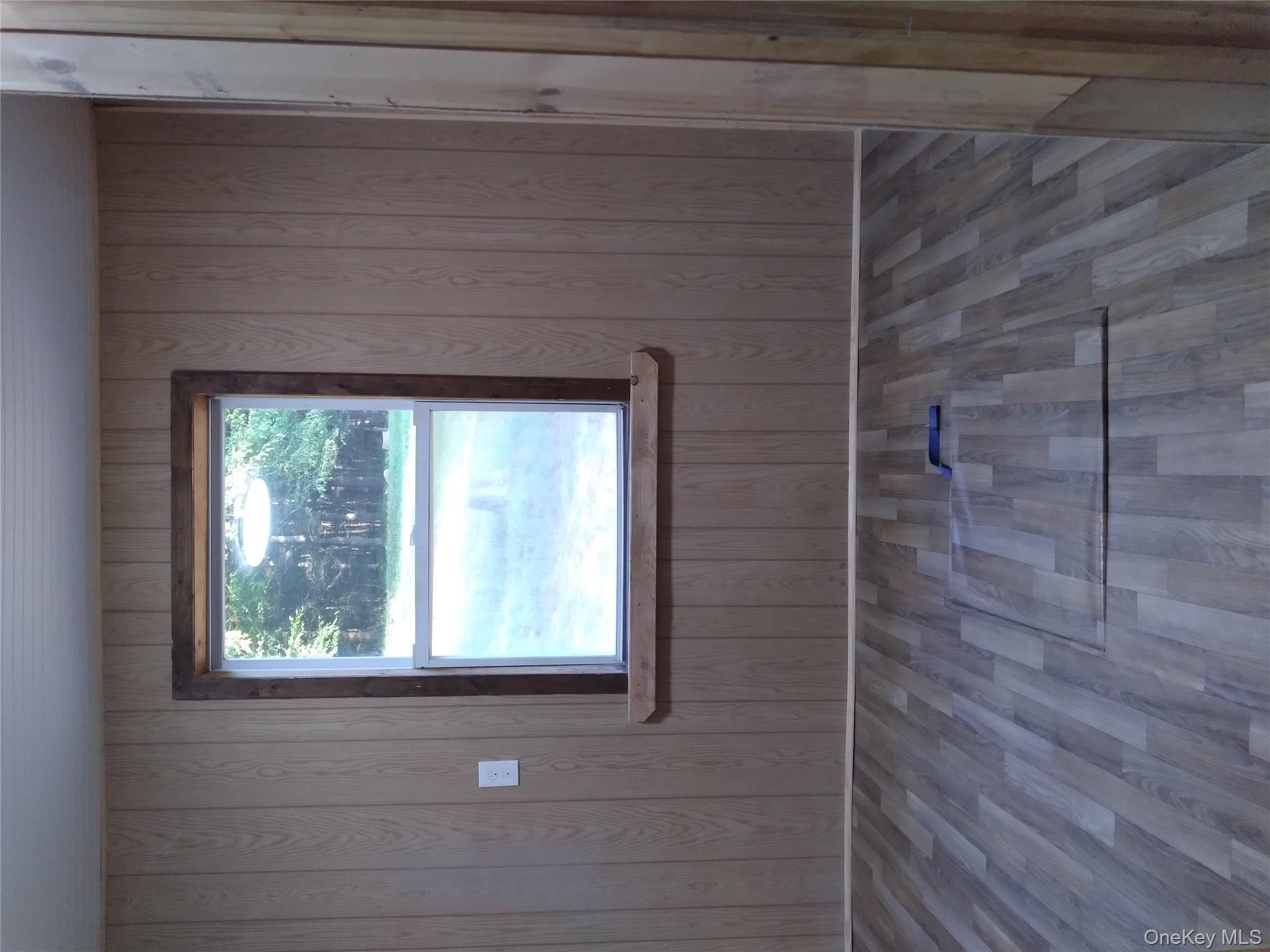 31 Willowemoc Road Livingston Manor, NY 12758 - Photo 16 of 23 an empty room with wooden floor and windows