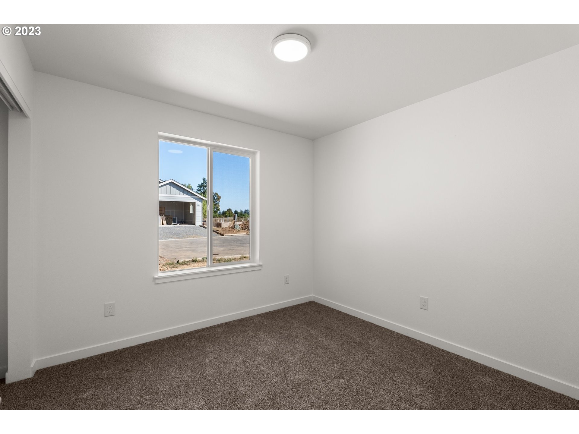 1019 Peach Road Winlock, WA 98596 - Photo 18 of 22 a view of an empty room with a window