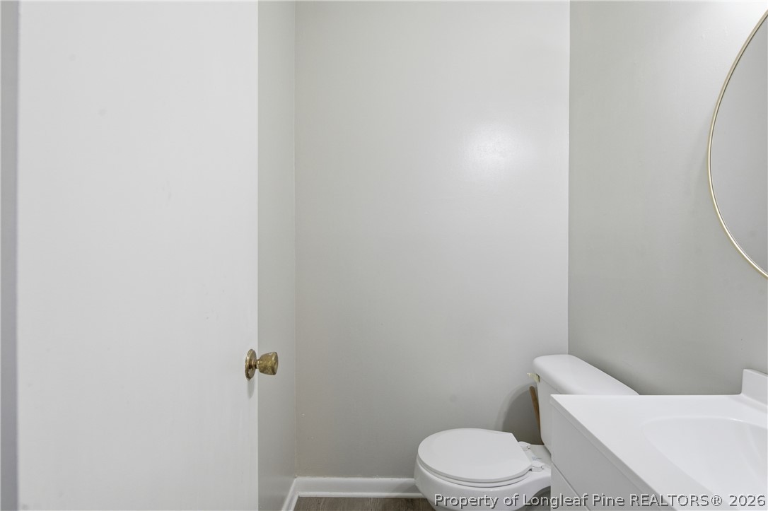 6319 Rustic Ridge Hope Mills, NC 28348 - Photo 23 of 39 a white toilet sitting next to a shower