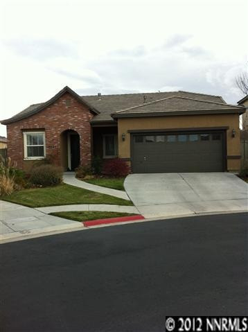 10648 Eagle Falls Way Reno, NV 89521 - Photo 1 of 1 a front view of a house with a yard and garage