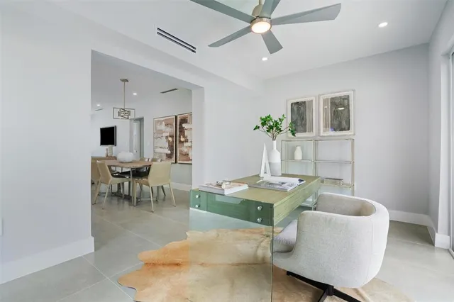 a bathroom with a sink a toilet a window and shower