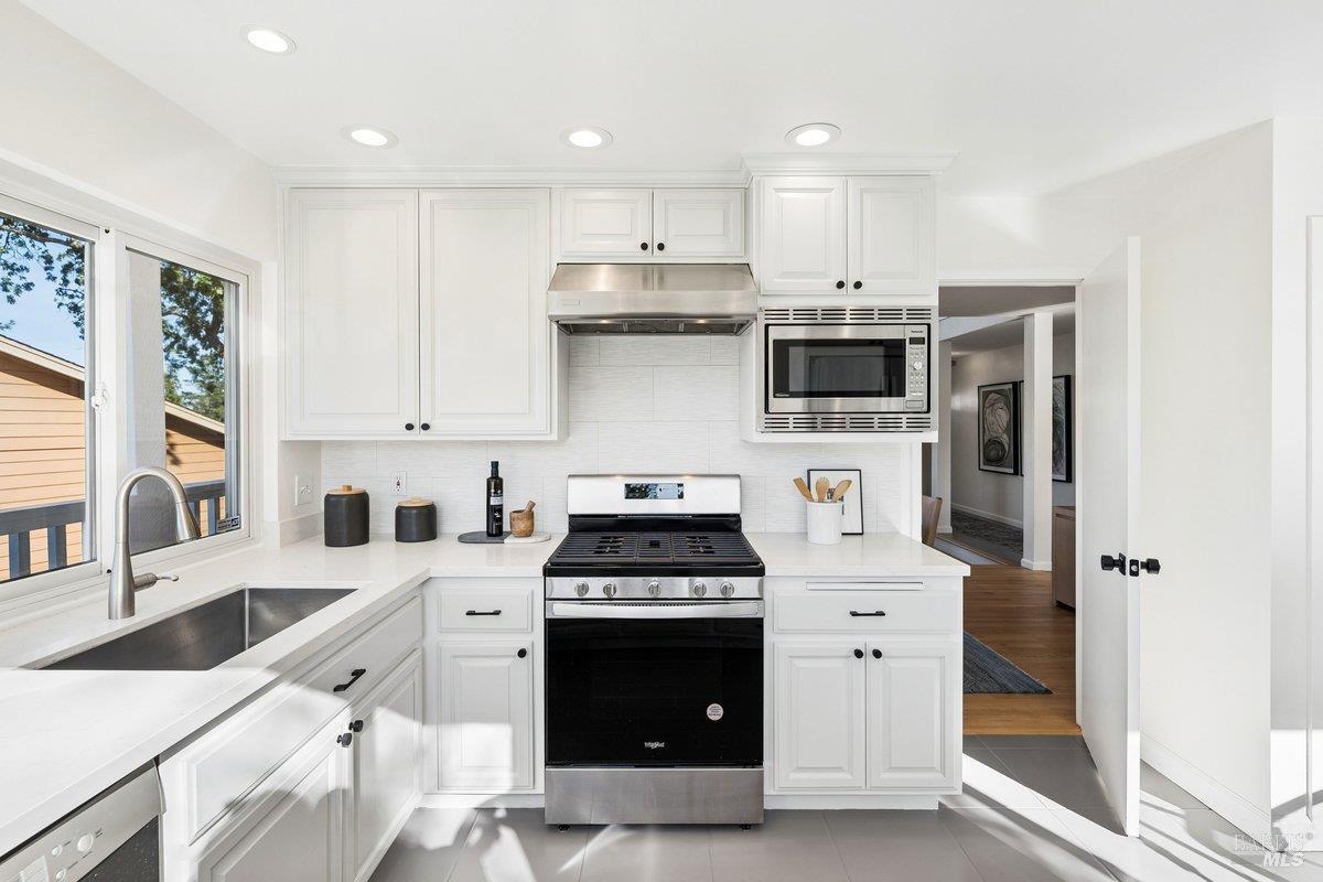 1036 Lea Drive San Rafael, CA 94903 - Photo 17 of 88 a kitchen with stainless steel appliances a stove a sink and a refrigerator