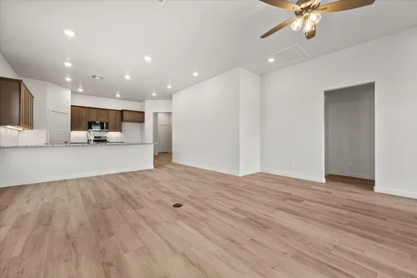 a view of a kitchen with a sink and a stove top oven