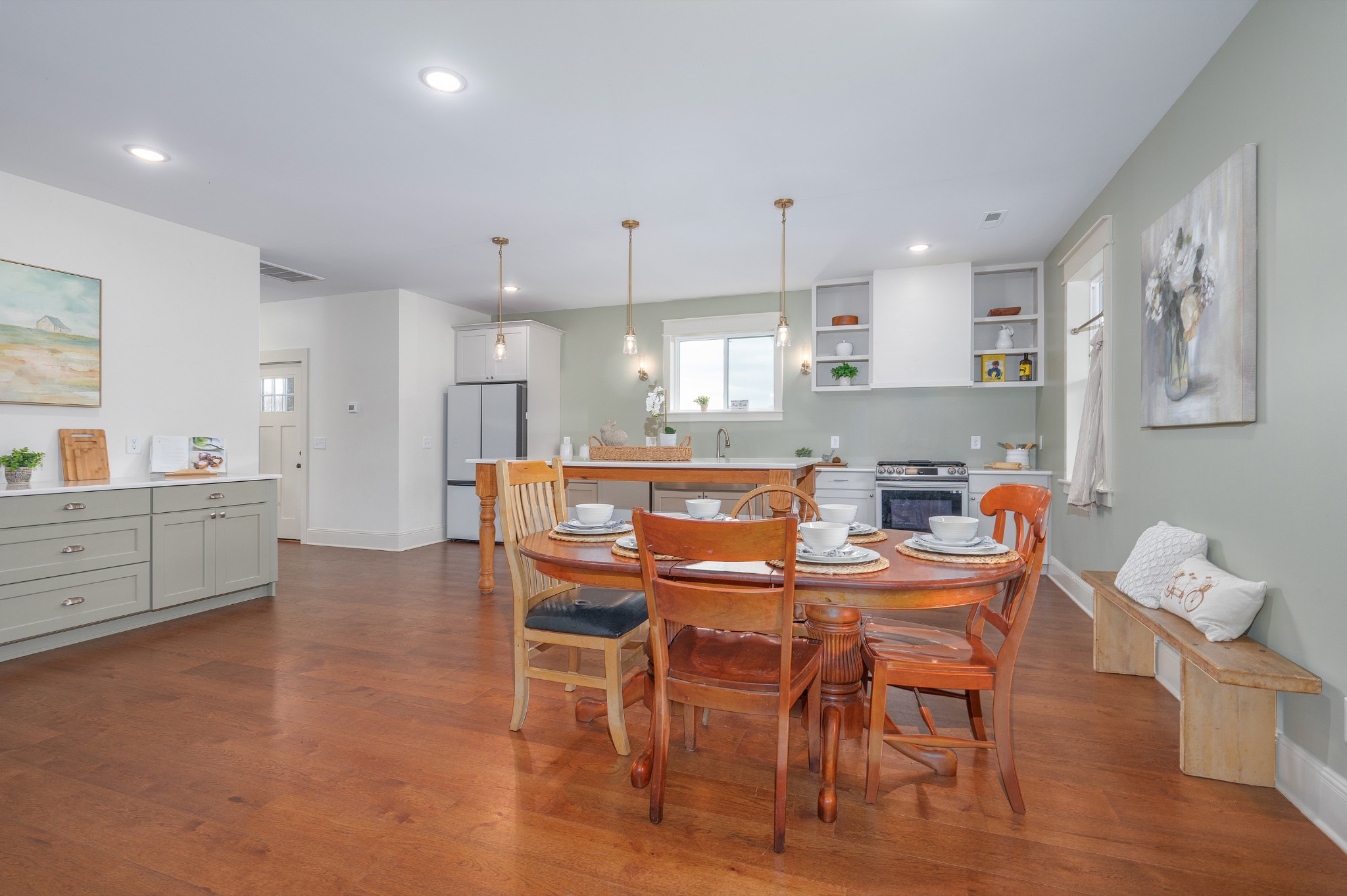 153 Lewis Road Morrison, TN 37357 - Photo 13 of 45 a kitchen with stainless steel appliances kitchen island granite countertop a dining table chairs and a refrigerator