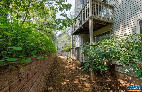 a view of a patio with table and chairs and potted plants