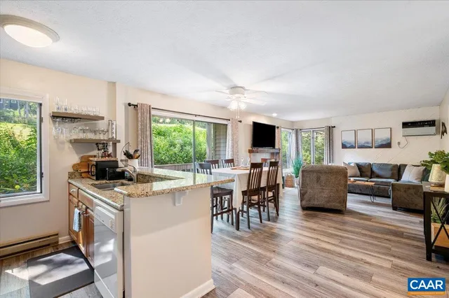 a kitchen with stainless steel appliances granite countertop a stove and a refrigerator