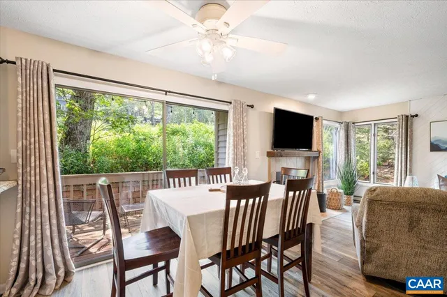 a view of a dining room with furniture window and wooden floor