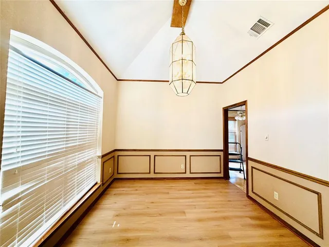 a view of a room with wooden floor and stairs