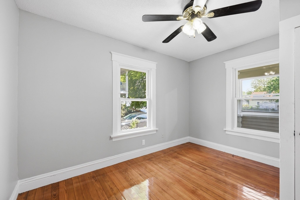 62 Kenyon Street Springfield, MA 01109 - Photo 10 of 26 wooden floor in an empty room with a window