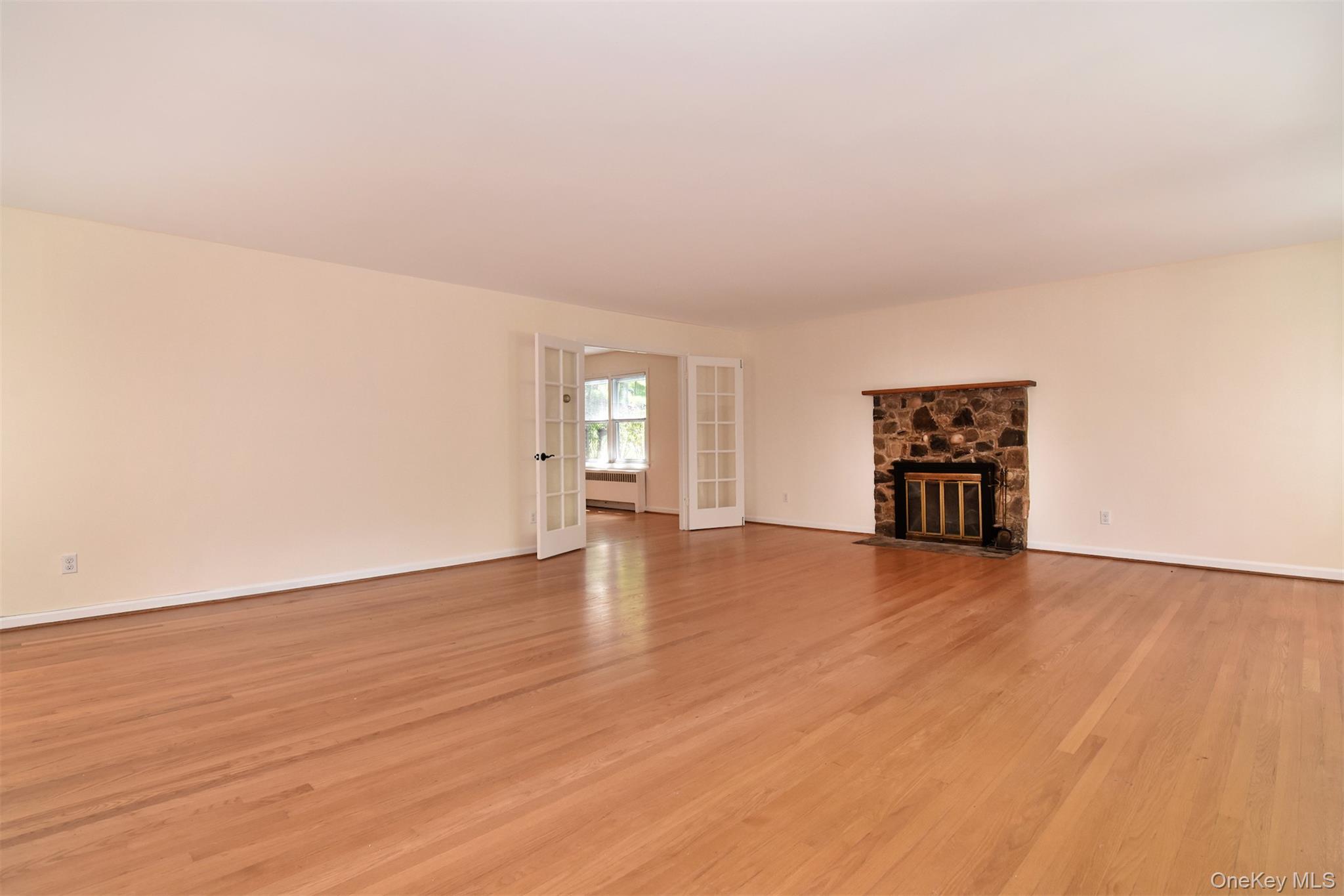74 Briary Road Dobbs Ferry, NY 10522 - Photo 4 of 19 Living room with French doors to dining room.