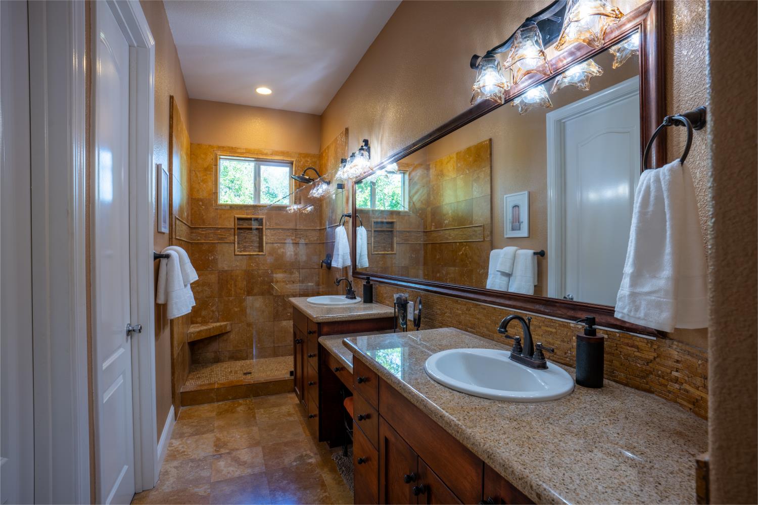 3388 Sudbury Road Cameron Park, CA 95682 - Photo 15 of 47 a bathroom with a sink double vanity granite and a mirror