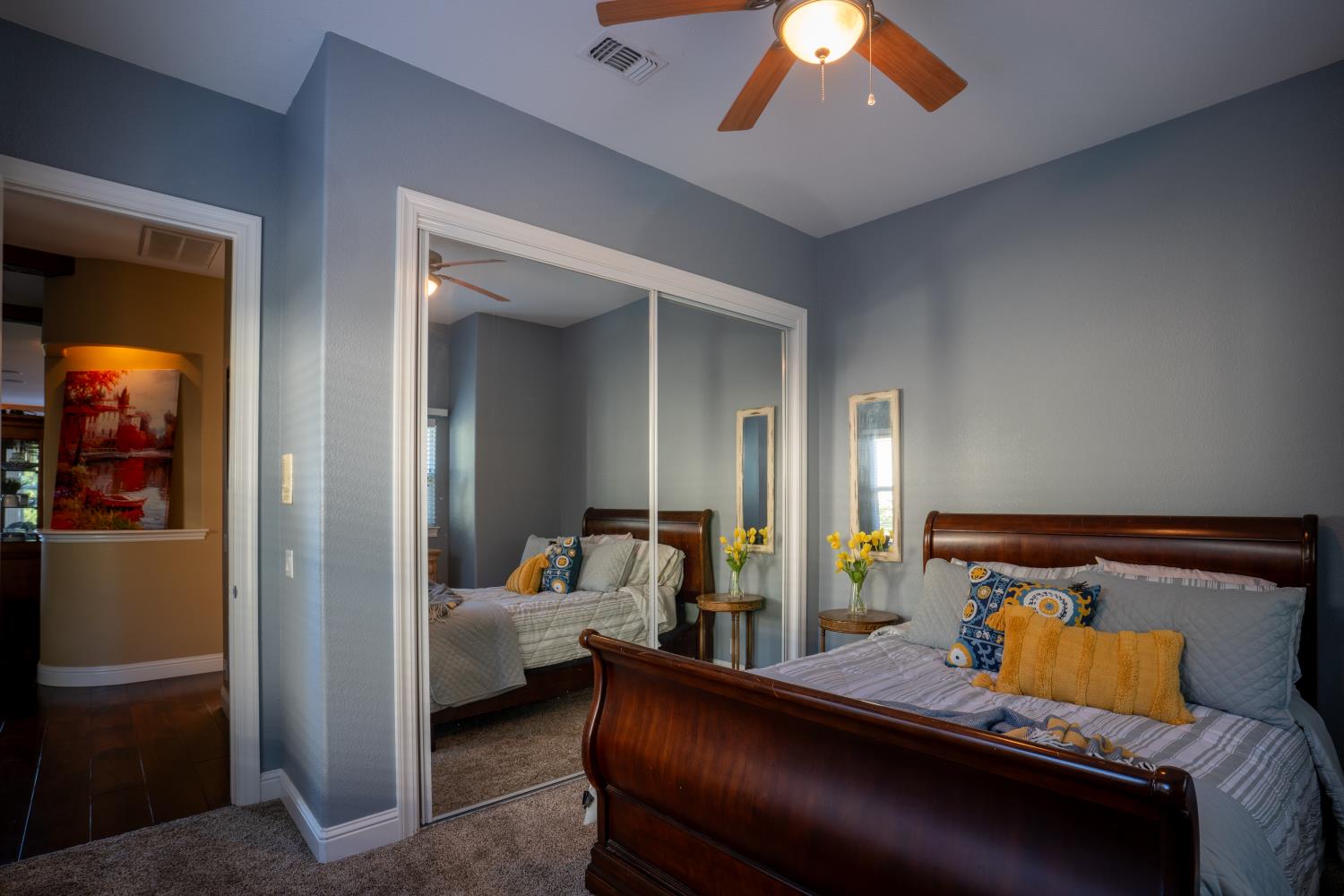 3388 Sudbury Road Cameron Park, CA 95682 - Photo 17 of 47 a bedroom with furniture and a chandelier