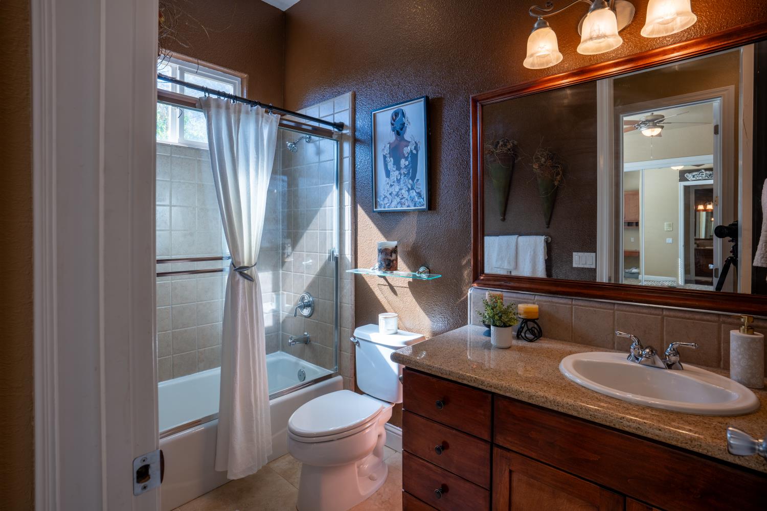 3388 Sudbury Road Cameron Park, CA 95682 - Photo 18 of 47 a bathroom with a granite countertop sink toilet and shower