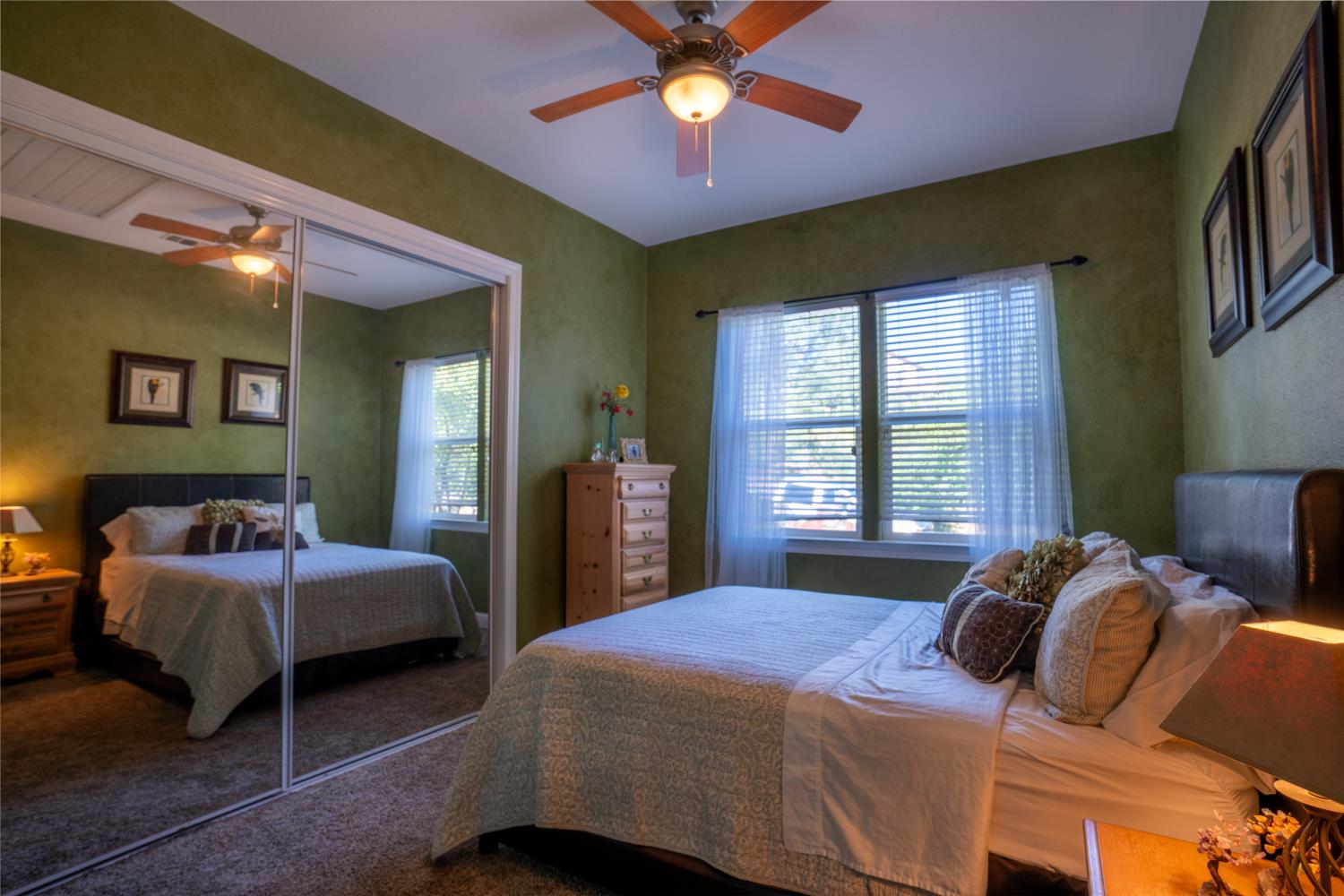 3388 Sudbury Road Cameron Park, CA 95682 - Photo 20 of 47 a bedroom with a bed and a chandelier