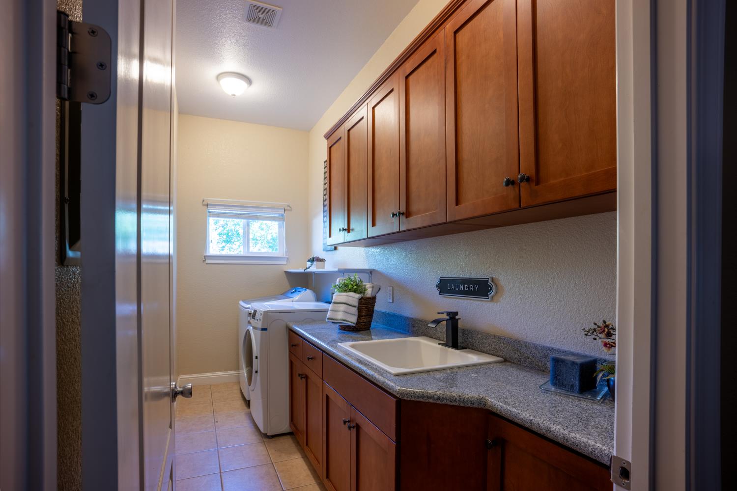 3388 Sudbury Road Cameron Park, CA 95682 - Photo 22 of 47 a kitchen with stainless steel appliances granite countertop a sink stove and cabinets