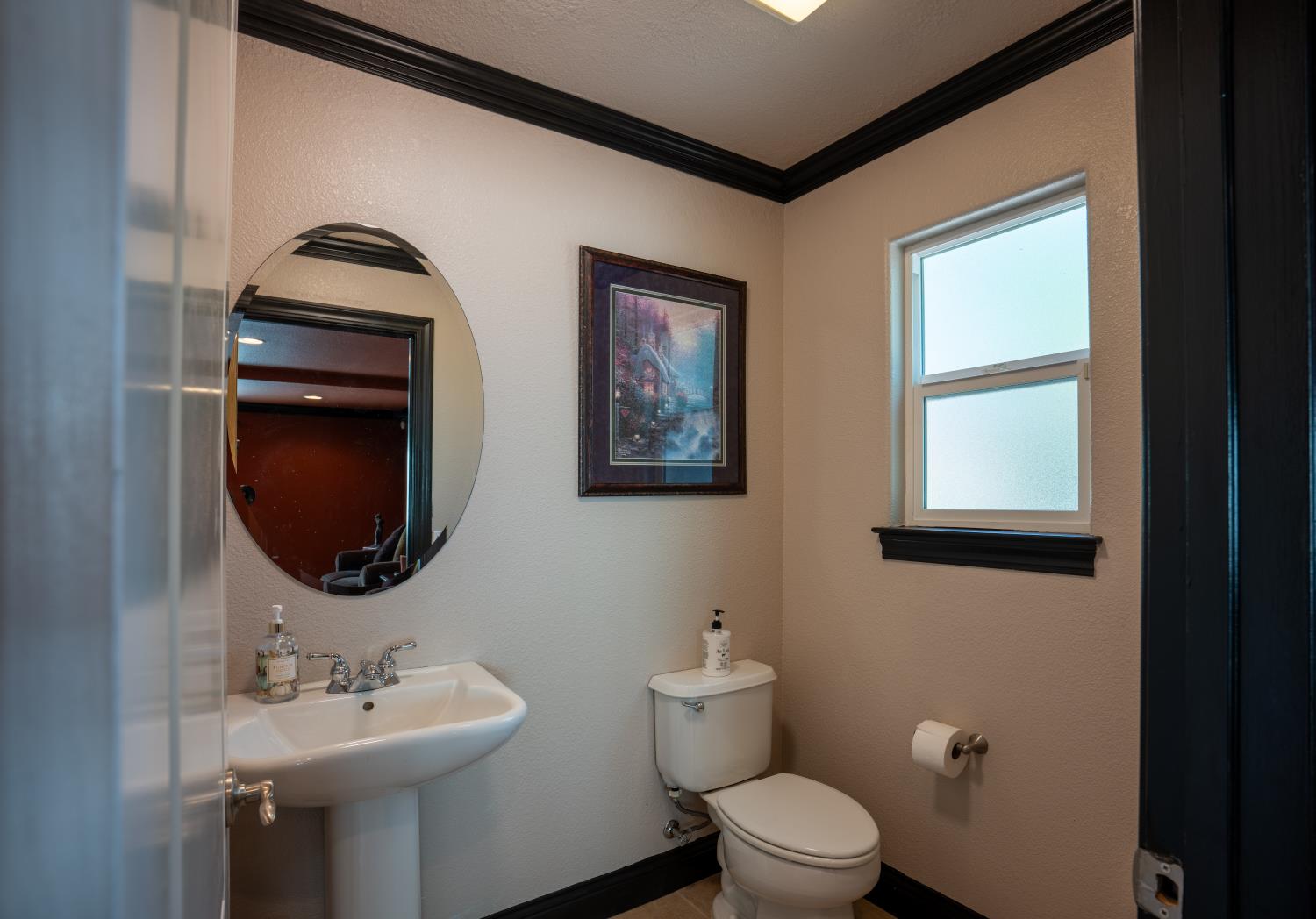 3388 Sudbury Road Cameron Park, CA 95682 - Photo 29 of 47 a bathroom with a toilet a sink and mirror