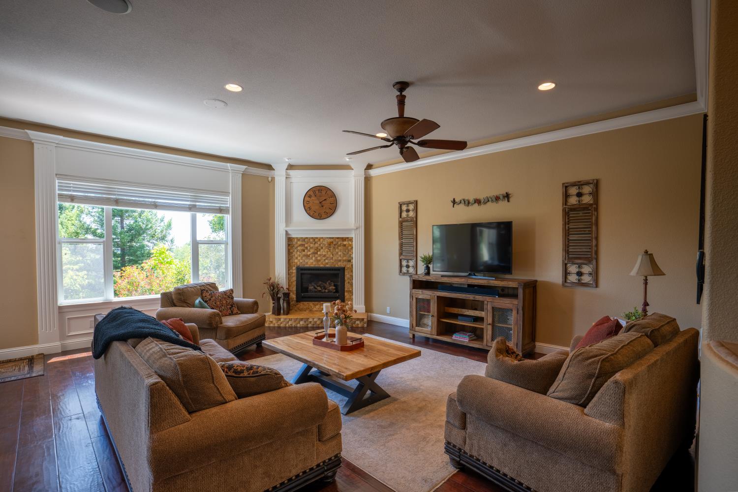 3388 Sudbury Road Cameron Park, CA 95682 - Photo 6 of 47 a living room with furniture a fireplace and a flat screen tv