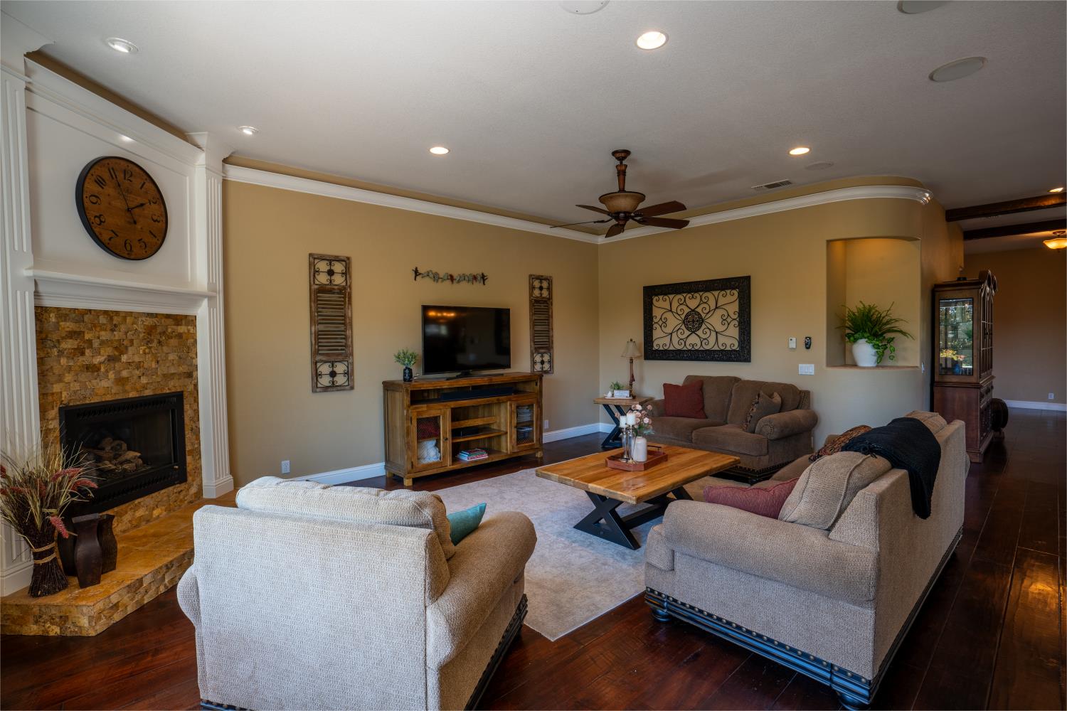 3388 Sudbury Road Cameron Park, CA 95682 - Photo 7 of 47 a living room with furniture a fireplace and a flat screen tv