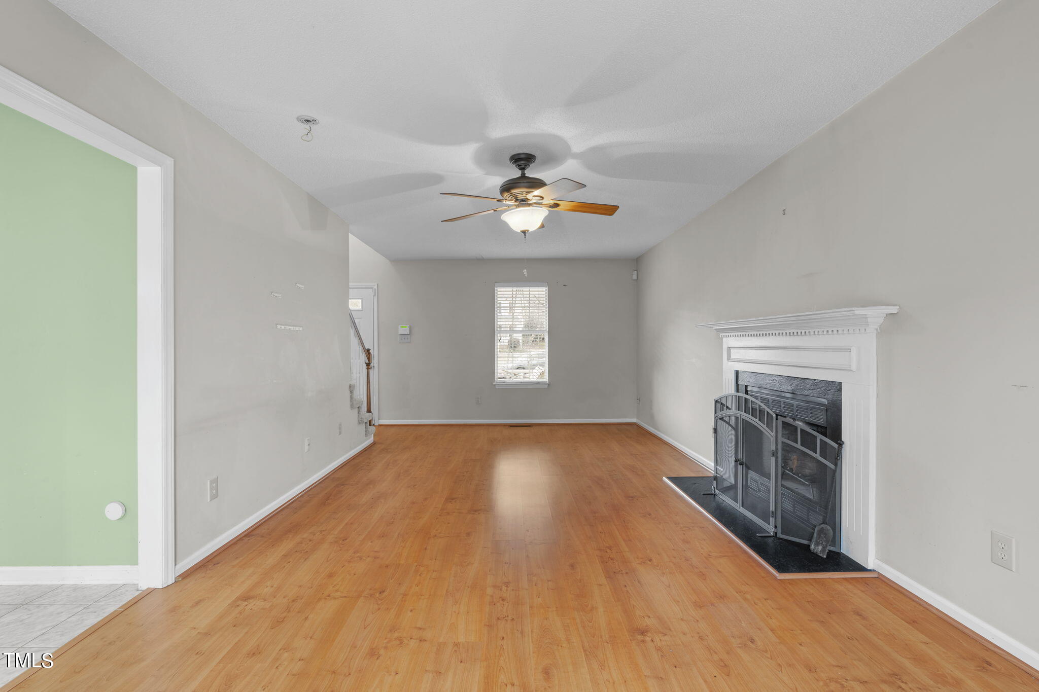 4624 Timberhurst Drive Raleigh, NC 27612 - Photo 11 of 29 wooden floor in an empty room with a window