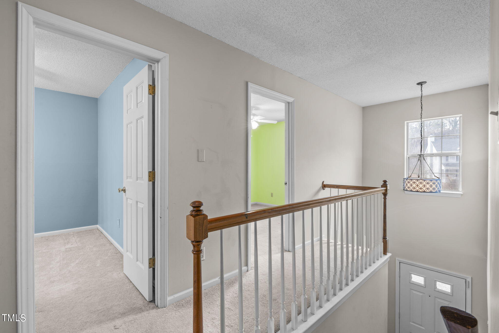 4624 Timberhurst Drive Raleigh, NC 27612 - Photo 19 of 29 a view of a hallway with windows
