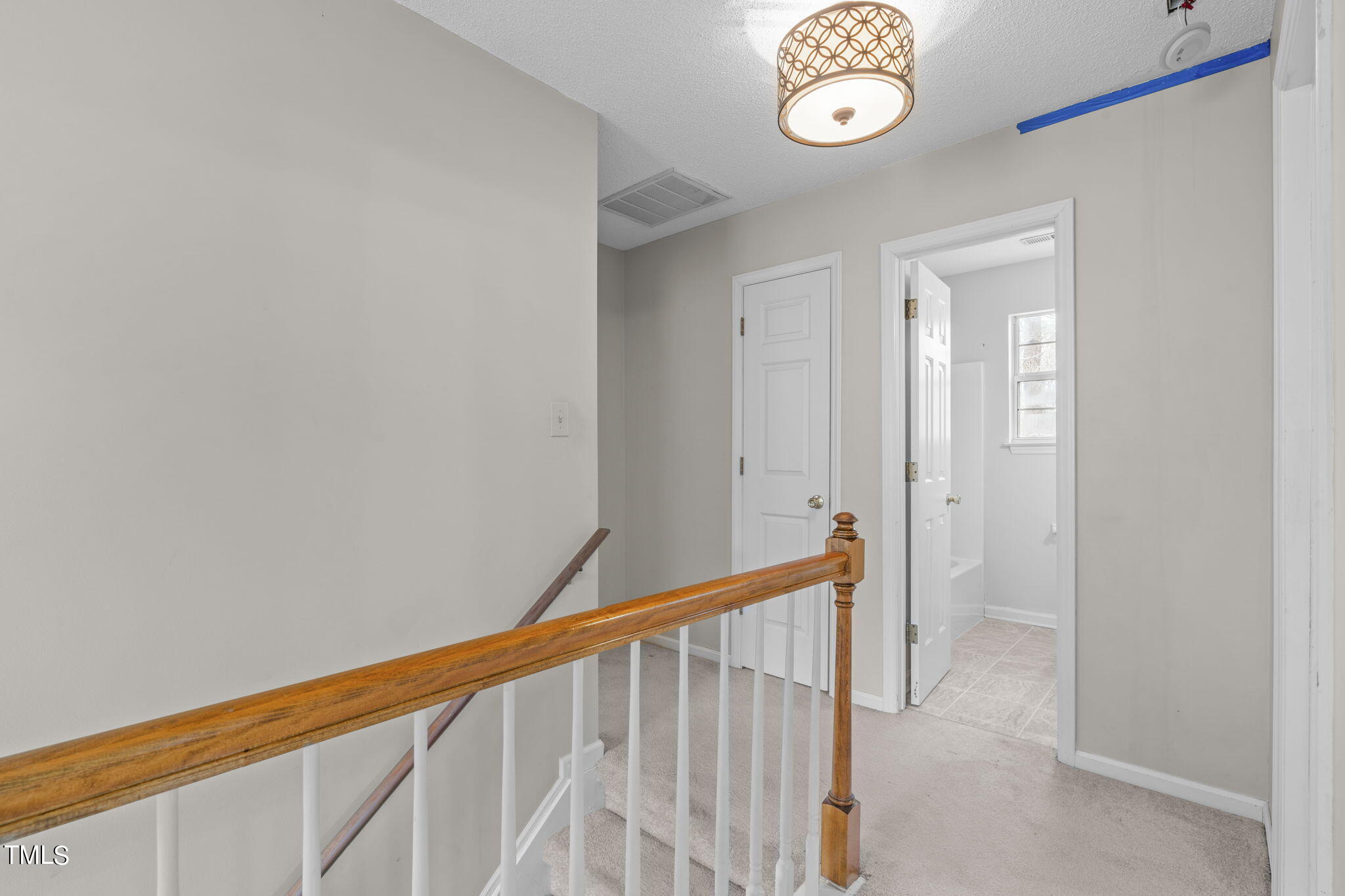 4624 Timberhurst Drive Raleigh, NC 27612 - Photo 20 of 29 a view of a hallway with entryway