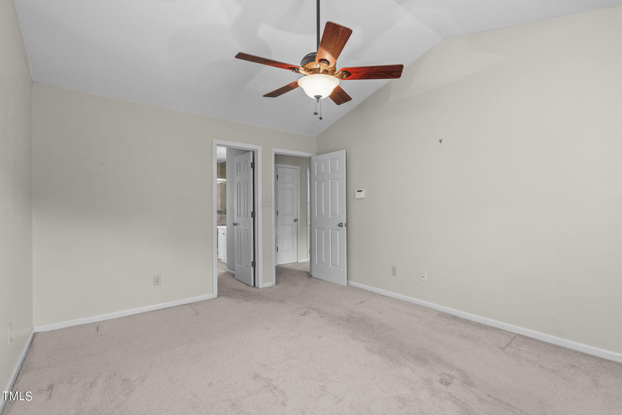 4624 Timberhurst Drive Raleigh, NC 27612 - Photo 21 of 29 an empty room with closet and ceiling fan