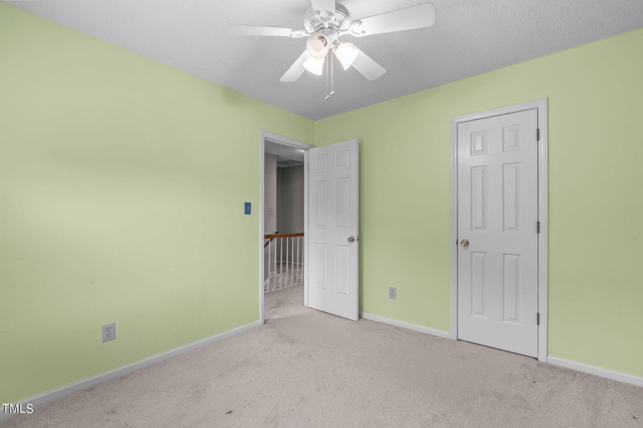 4624 Timberhurst Drive Raleigh, NC 27612 - Photo 25 of 29 an empty room and chandelier fan