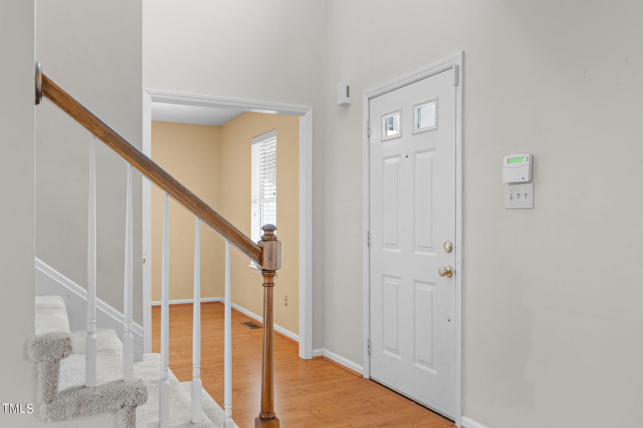 4624 Timberhurst Drive Raleigh, NC 27612 - Photo 8 of 29 a view of staircase with white walls and a window