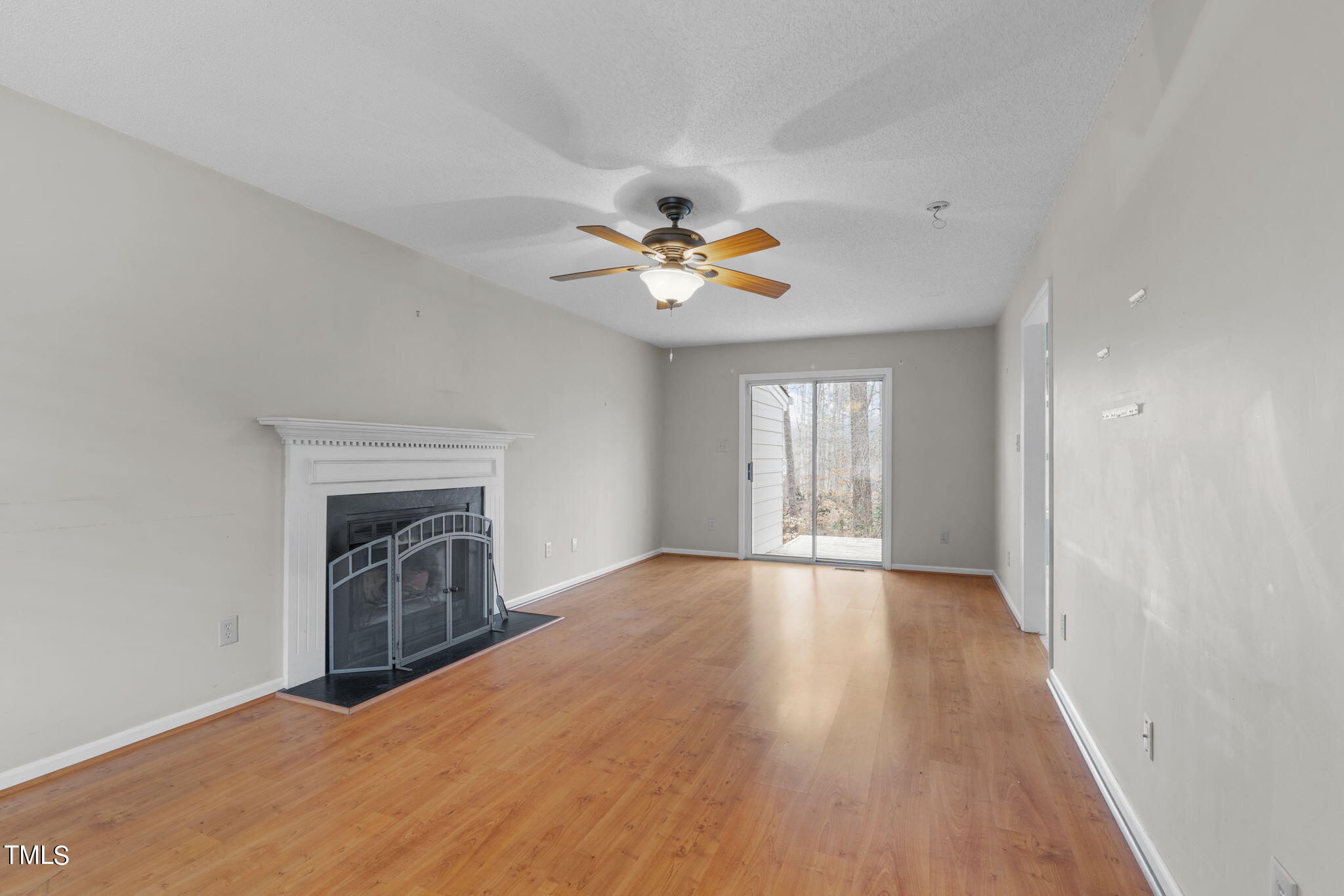 4624 Timberhurst Drive Raleigh, NC 27612 - Photo 9 of 29 an empty room with fan and windows