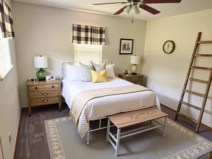 a bedroom with a bed and a dresser