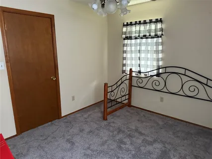 a view of a hallway with windows