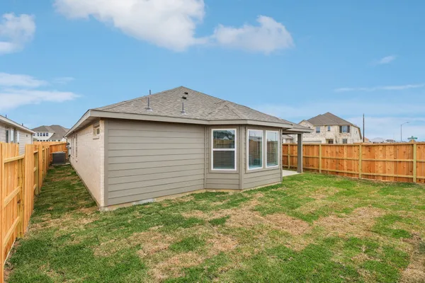 a view of a backyard of the house
